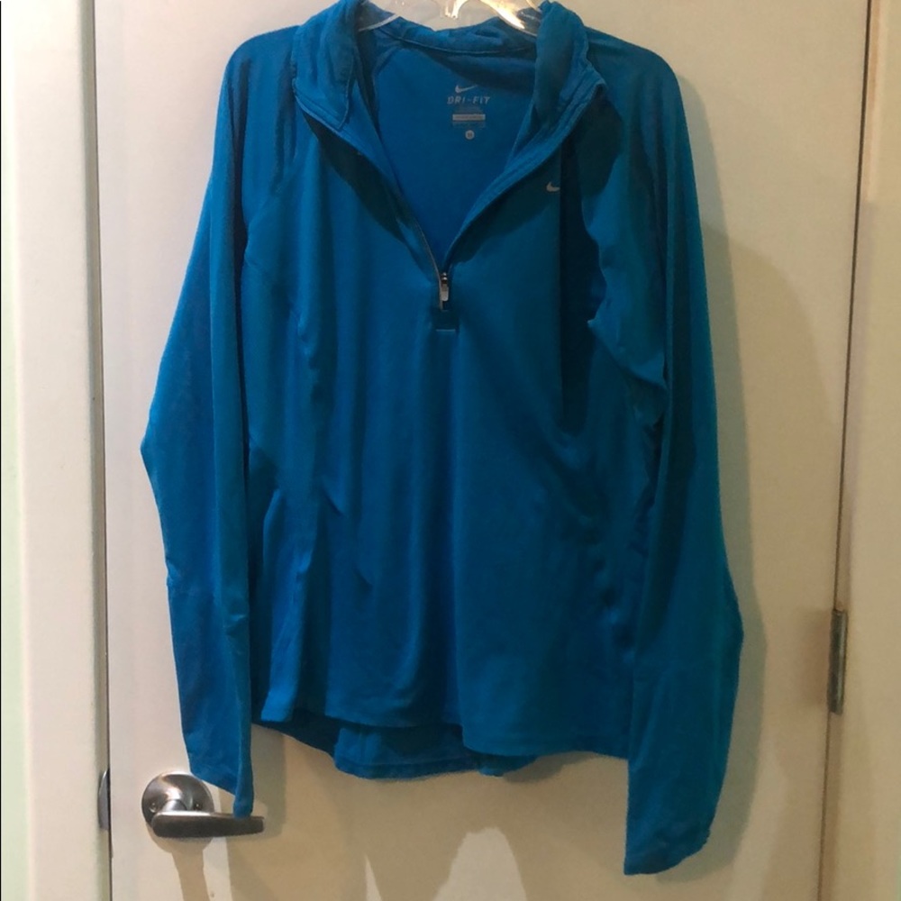 Long sleeve turquoise Nike zip up.